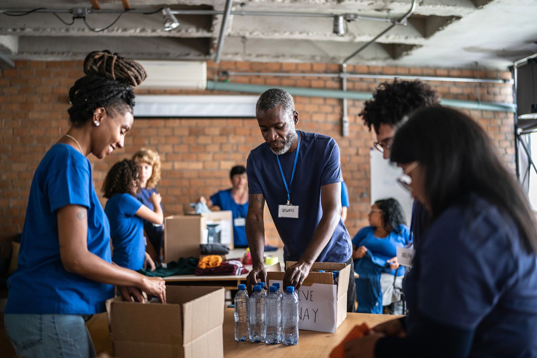 Community volunteers arranging donations at a charity event
